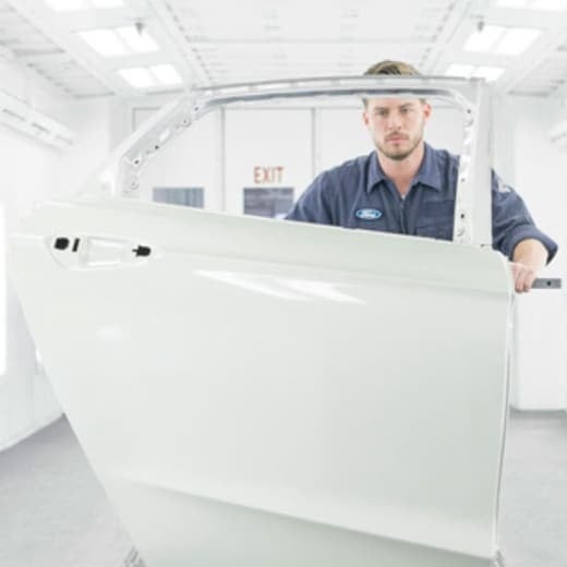 image of 1 man repairing a door
