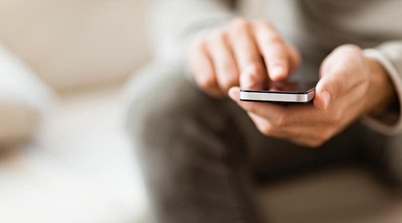 image of a person holding a phone